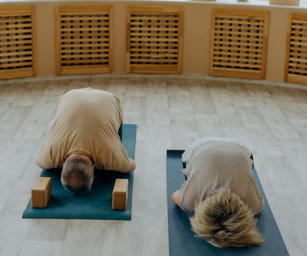 Minimalist yoga studio space with soft lighting and mats.
